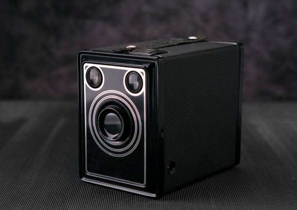 Old vintage film photo camera, lifestyle memory. Old vintage film 36mm photo camera, lifestyle memory. Take pictures with a manual lens history. dolby Atmos Speakers stock pictures, royalty-free photos & images